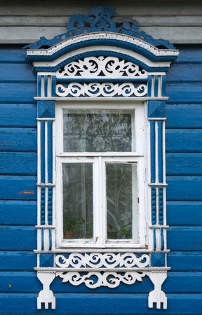 Beautiful window  with carved architravesの写真素材