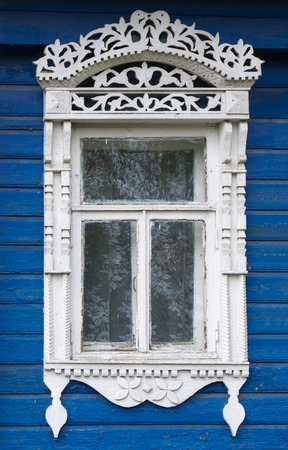 Beautiful window  with carved architravesの写真素材