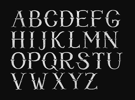 Decorative capital letters hand-drawn on a chalkboardの写真素材