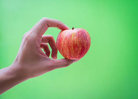 Red apple on handの写真素材