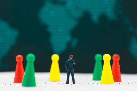 Miniature people : Businessmen stand to see the profit board of the company, check the progress of...