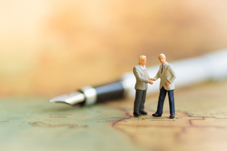 Miniature people : Business man make a deal, Business partner meeting concept.の写真素材
