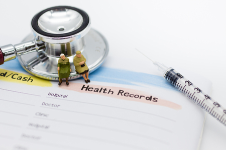 Miniature people: Elderly with annual health checkup. Image use for healthy concept.の写真素材