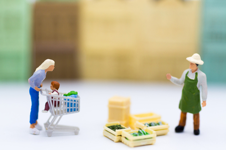 Miniature people : Shopping in the market for buy something necessary. Image use for marketing , business concept.の写真素材