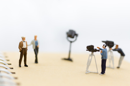 Miniature people : Small team of tv reporter with Celebrity Interviews, production television concept.の写真素材