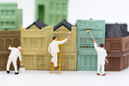 Miniature people: Workers are painting the building in town. Image use for  business concept.の写真素材