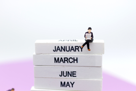 Miniature people: Teachers at the school prepare the content for teaching students. Image use for education concept.の写真素材