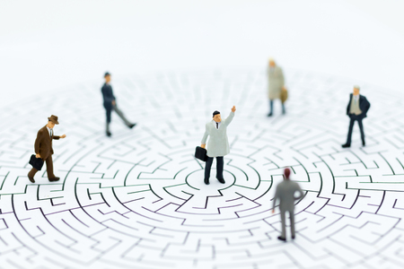 Miniature people : Businessmen are looking for a solution and teamwork. Image use for solve problems and new idea concept.の写真素材