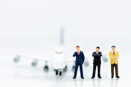 Miniature business people : businesses team with plane. Image use for background travel, business trip travel advisory agency of transportation concept.の写真素材