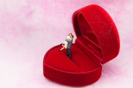 Miniature people: Couple hug each other to show love. Image use for Valentine's day concept.の写真素材