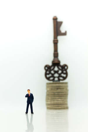 Miniature people: Businessmen stand with keys. Image use for key man, the key to success, business concept.の写真素材