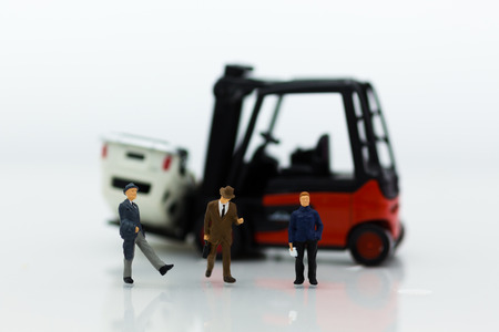 Miniature people : Group people auto insurance when an accident on the road. Image use for Make an agreement, responsibility, business concept.の写真素材