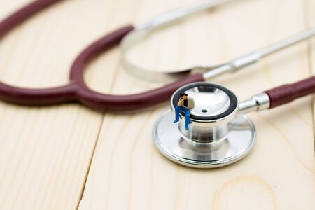 Miniature people: Man with annual health checkup. Image use for healthy concept.の写真素材