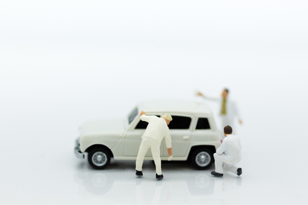 Miniature people : Worker clean a car. Image use for cleaning and maintenance, business concept.の写真素材