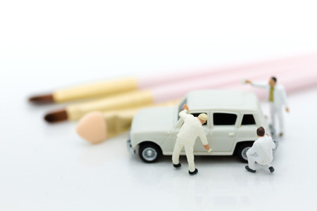 Miniature people : Worker make up the car. Image use for cleaning and maintenance, business autocar concept.の写真素材