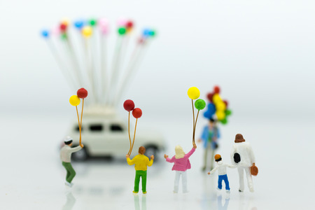 Miniature family: Childrens playing balloon together. Image use for background International families concept.の写真素材