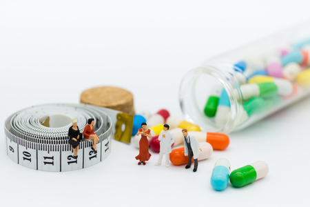 Miniature people: Patients discuss health issues with the doctor. Image use for Health check concept.の写真素材