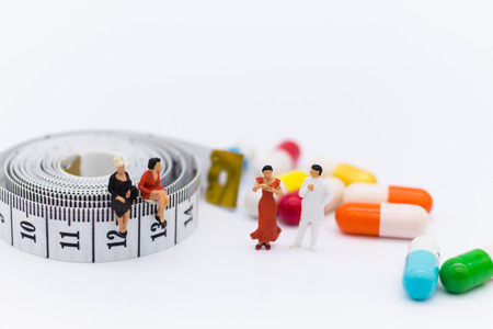 Miniature people: Patients discuss health issues with the doctor. Image use for Health check concept.の写真素材
