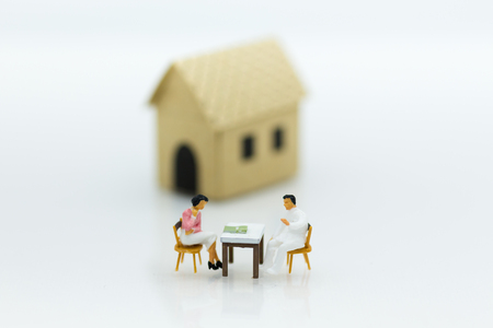 Miniature people: Business consultants on financial transactions for home loan, miniature people. Image use for financial, business concept.の写真素材