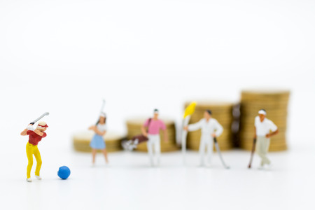 Miniature people : Businessmen spend their free time for Golf activities. Image use for sport, hobbies concept.の写真素材