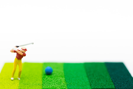 Miniature people : Businessmen spend their free time for Golf activities. Image use for sport, hobbies concept.の写真素材