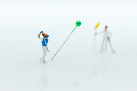 Miniature people : Businessmen spend their free time for Golf activities. Image use for sport, hobbies concept.の写真素材