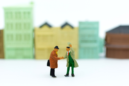 Miniature people : Businessman make a deal, Business partner meeting concept.の写真素材