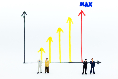 Miniature people: Businessman stand front of dashboard, display graphs, profit margins of  background. Image use for business concept.の写真素材