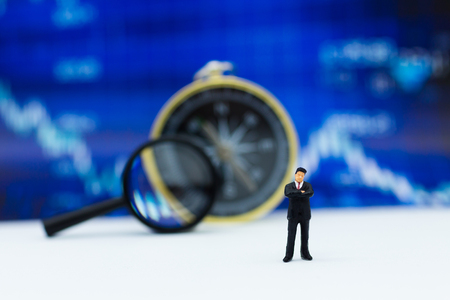 Miniature people: Businessman stand front of dashboard, display graphs, profit margins of  background. Image use for business concept.の写真素材