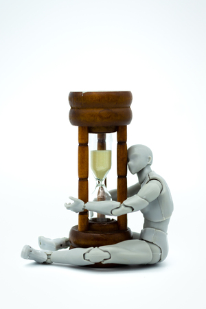 Robot model with hourglass. Image use for time to move forward.の写真素材