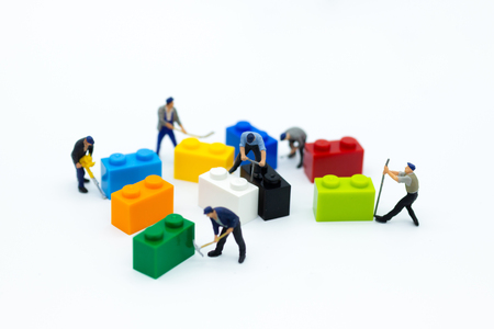 Miniature people: Worker use tools with the colorful boxes for repair. Image use for background business of maintenance, service concept.の写真素材