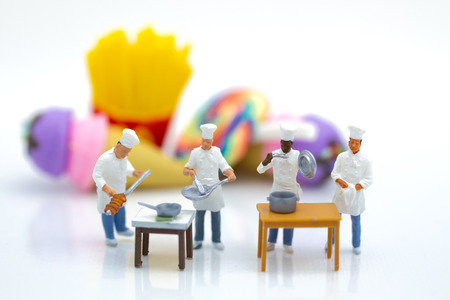 Miniature people : Chefs are preparing food for cook in kitchen. Image use for new menu creation, food and beverage concept.の写真素材
