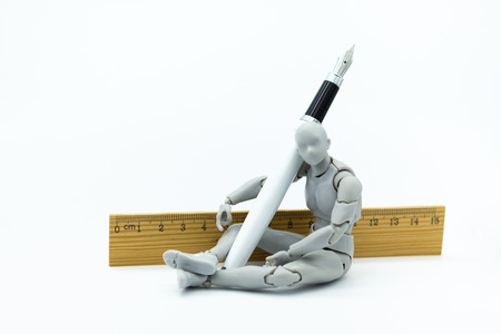 Robot model with pen and ruler. Image use for create idea of work , business concept.の写真素材