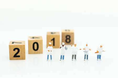 Miniature people: Chef standing with wooden block 2018. Image use for create idea for food...