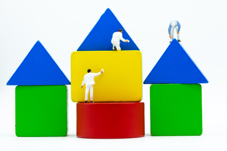 Miniature people: Painters are painting the colorful of puzzle piece. Image use for art, background concept.の写真素材