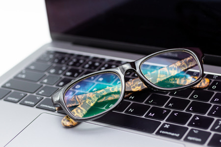 Eyeglasses places on the computer. Image use for resting eyes during work.の写真素材