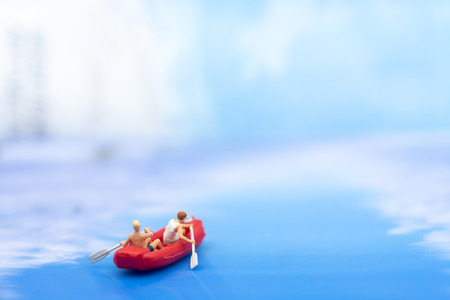 Miniature people, Rowing boat in the ocean. Image use for sports concept.の写真素材