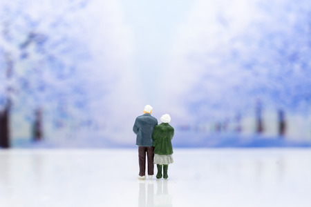 Miniature people: Couple show each other to show love, travel together . Image use for Valentine's day concept.の写真素材