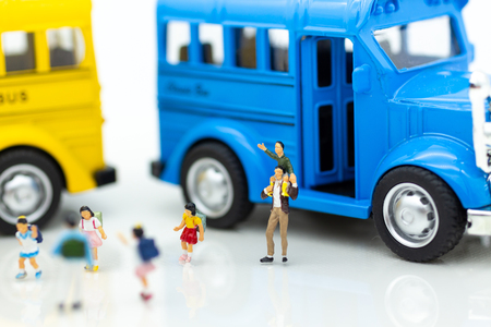 Miniature people : Children,students going to school with school bus. Image use for back to school,...