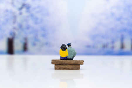 Miniature people: Couple show each other to show love, travel together . Image use for Valentine's...