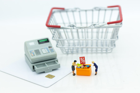 Miniature people : Shopper with shopping discount items, payment by credit card. Image use for Business and shopping concept.の写真素材