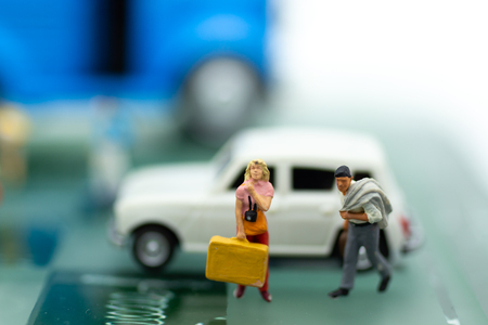 miniature people, backpack waiting bus at bus station for travel.の写真素材