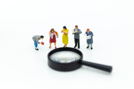 Miniature people: Students read books with magnifying glass . Image use for education concept.の写真素材