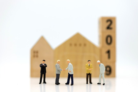 Miniature people: Group business meeting guaranteed loan, third party, guarantor. Image use for...