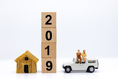 Miniature people : Businessman standing with car. Image use for Advertising product in the market today, competition on the business trading.の写真素材