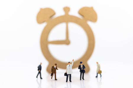Miniature people : Businessmen and watches, use images for reporting work time per day, calculate salary of employee.の写真素材