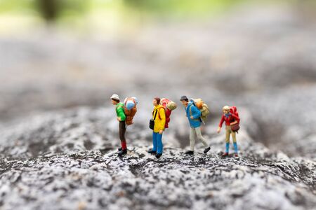 Miniature people : traveler walking on the road. Used to travel to destinations on travel business...