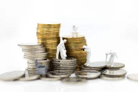 miniature people: Financial auditors are investigating the source of revenue. Image use for financial, business concept.の写真素材