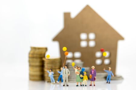 Miniature people: Children holding balloon with family at home . Image use for background International day of families concept.の写真素材