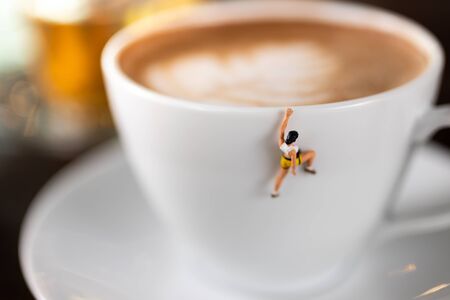 Miniature people : Coffee cup , image use for charge your energy in the morningの写真素材